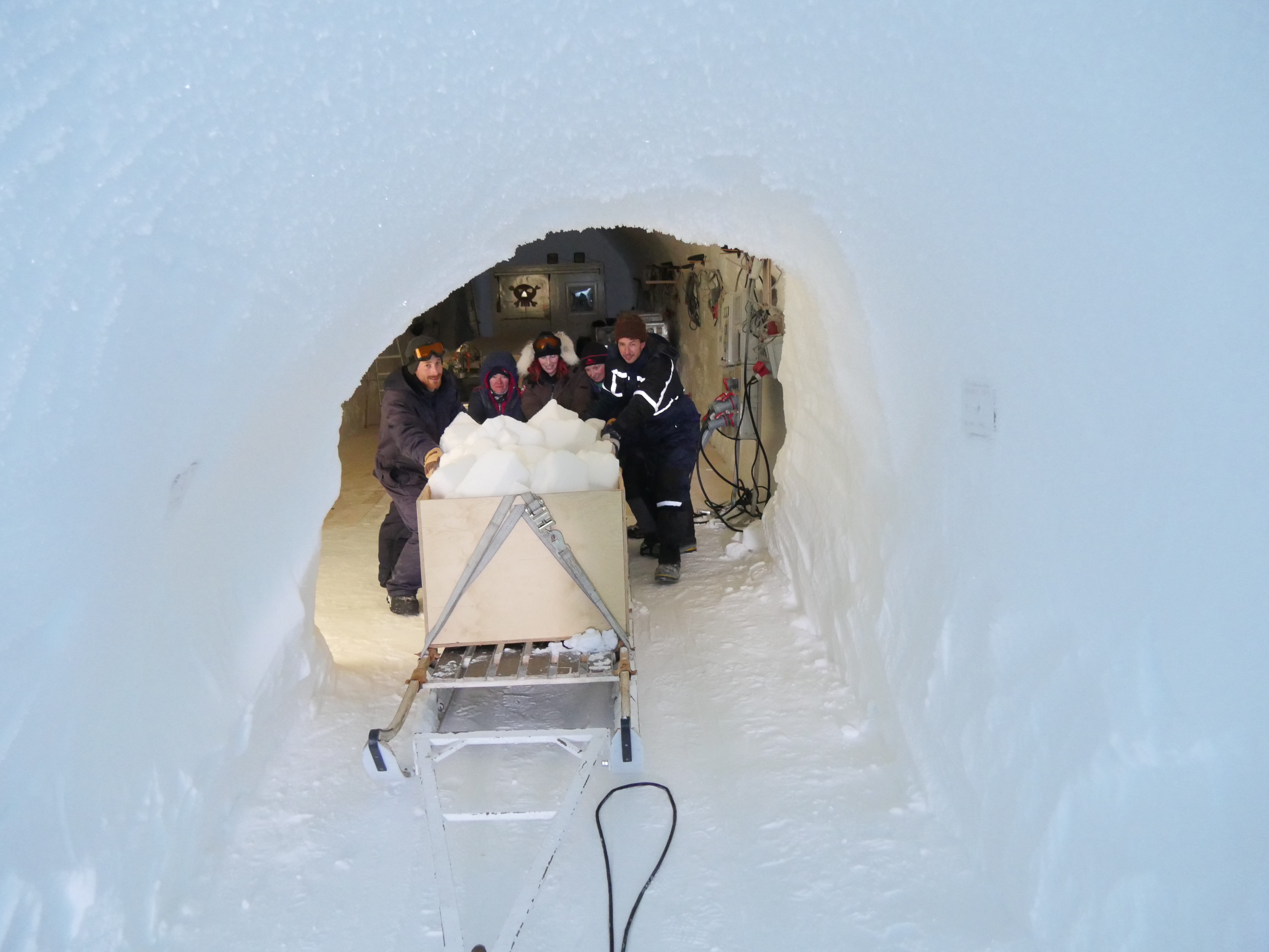 Pushing excess snow up the ramp from the trenches