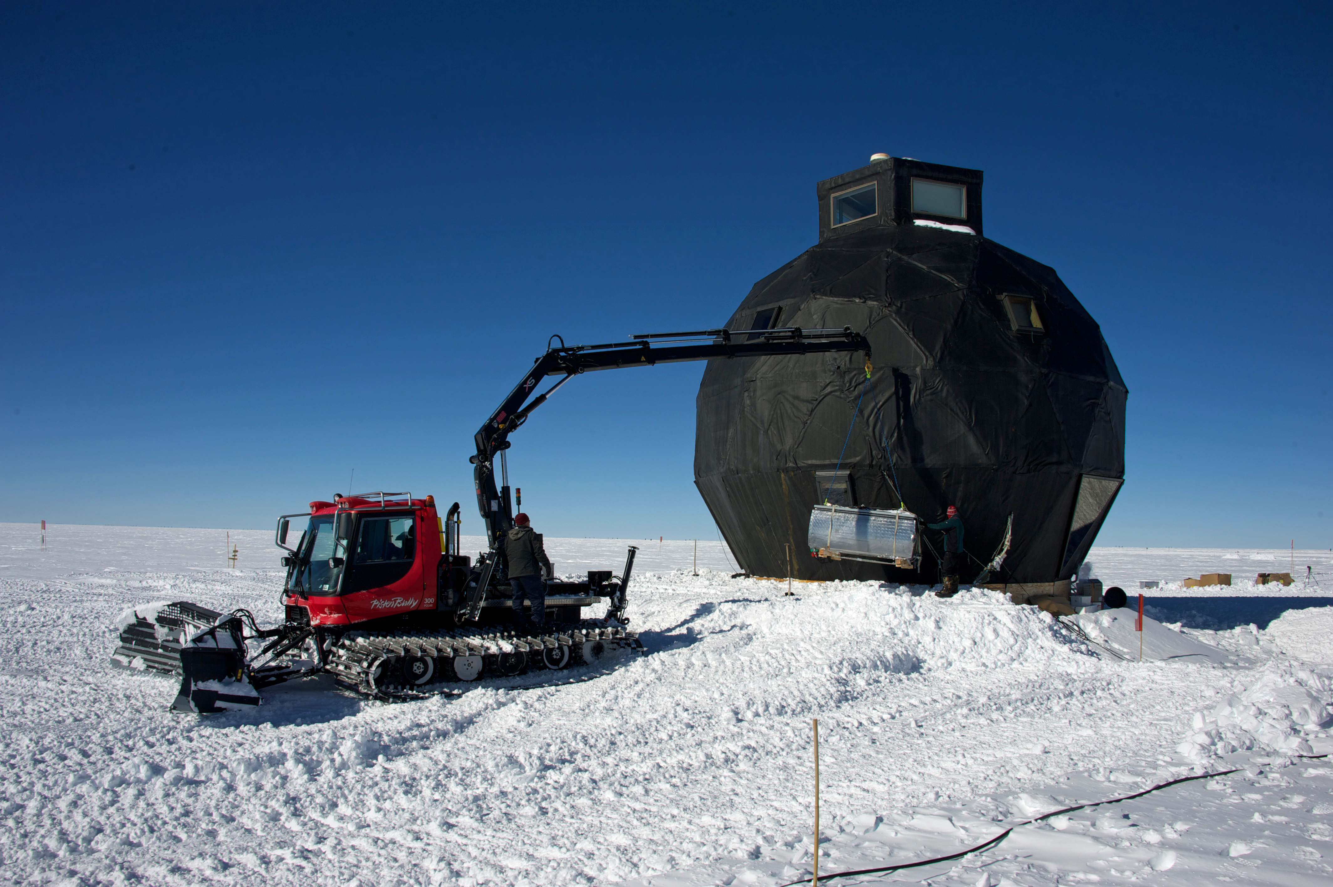 After storage in the garage during winter, the large water melter for washing and cleaning is reinstalled next to the dome.