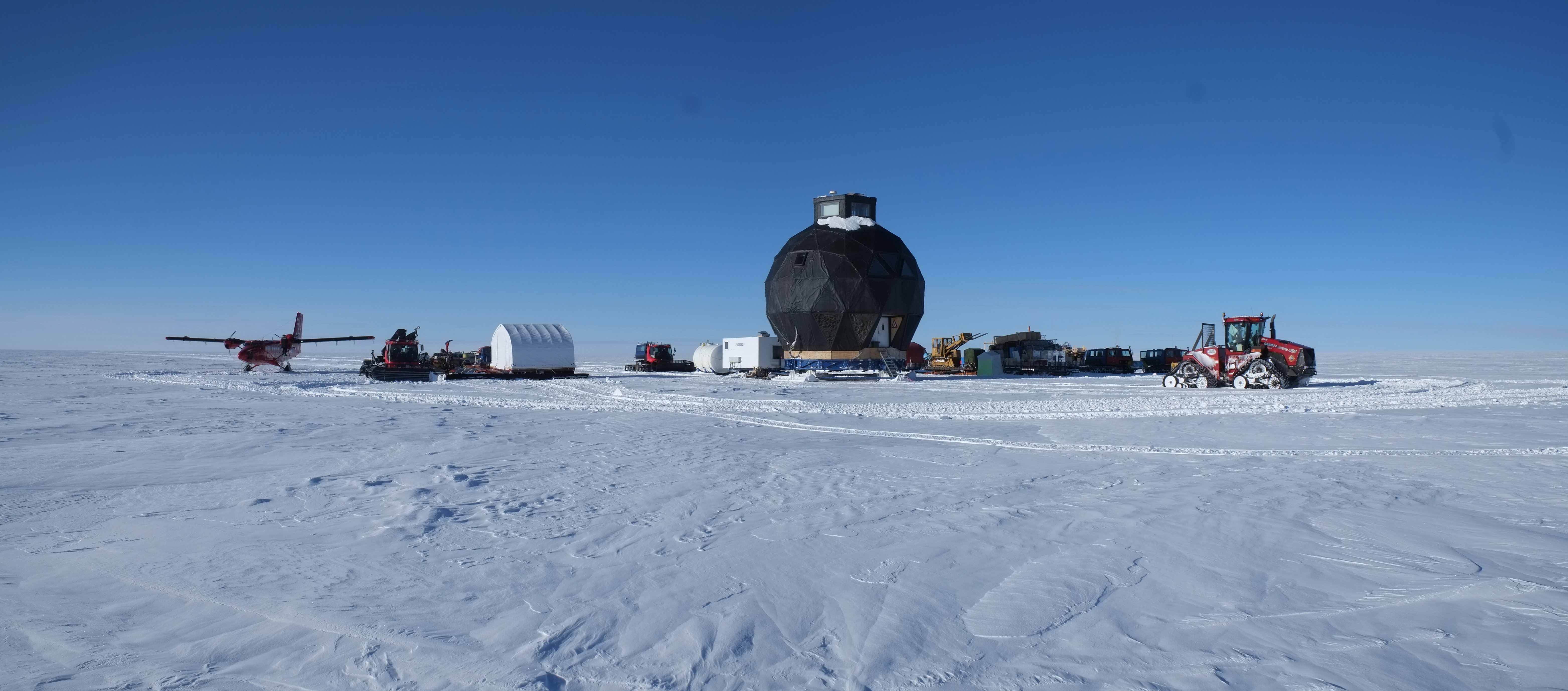 EGRIP traverse camp on the ridge with Twin Otter aeroplane.