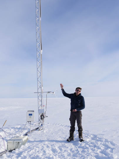 HC presenting the sampling tower next to the vapour tent. The tower has vapour inlets feeding a Picarro laser-absorption cavity-ring-down spectrometre for   isotope measurements and a sonic anemometer.