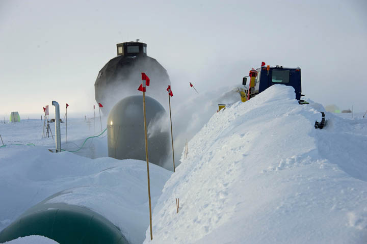 The balloons are slowly covered with blown snow which hardens to form the roofs