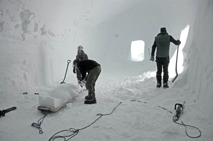 Inside the newly cast trenches, walls and floors are trimmed